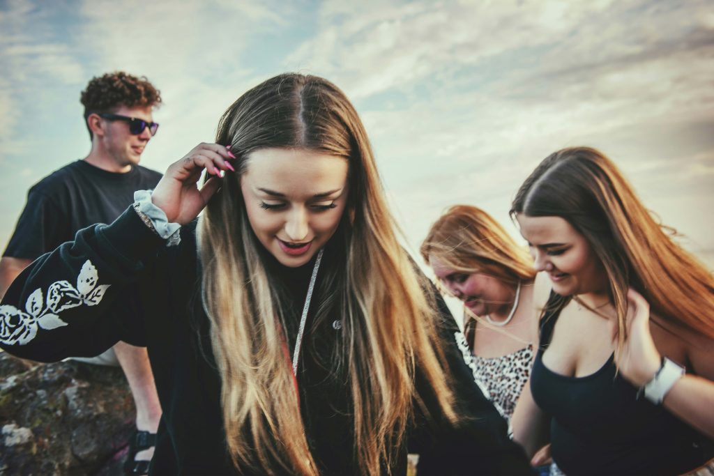 Group of teenagers walking together outdoors, representing peers who may witness situations where active bystander action matters.